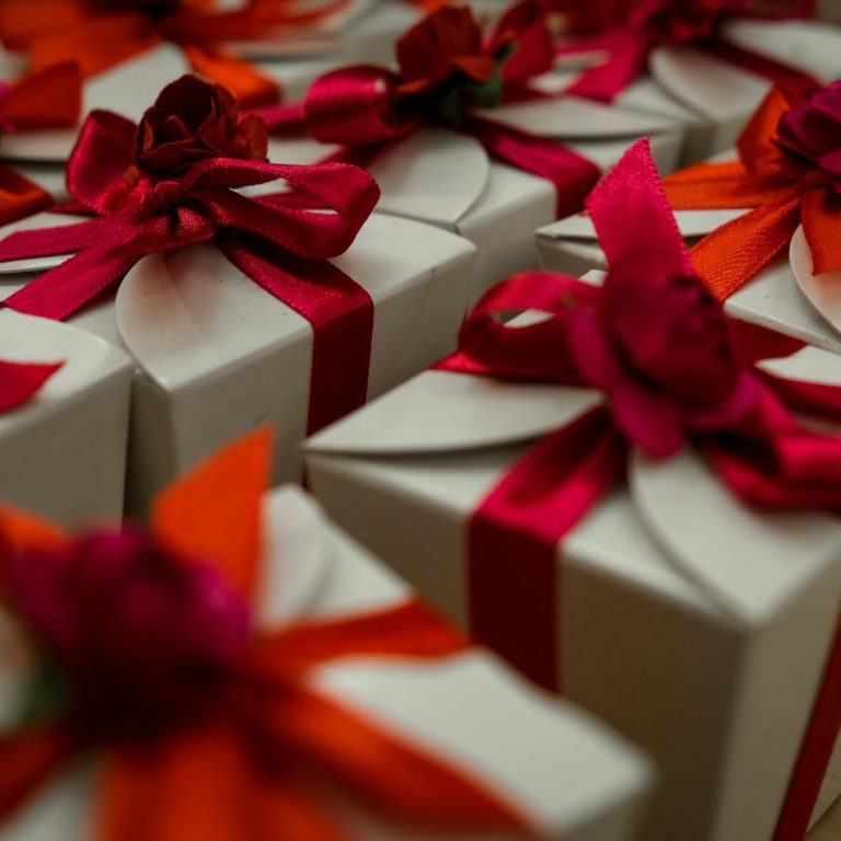 Multiple gifts all in matching boxes and red satin ribbon Multiple gifts all in matching boxes and red satin ribbon, perfect for wedding favours or a corporate gift.